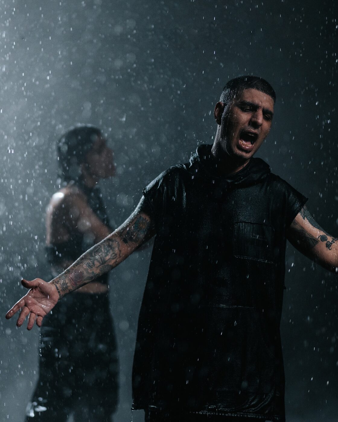 Singer performing in heavy rain